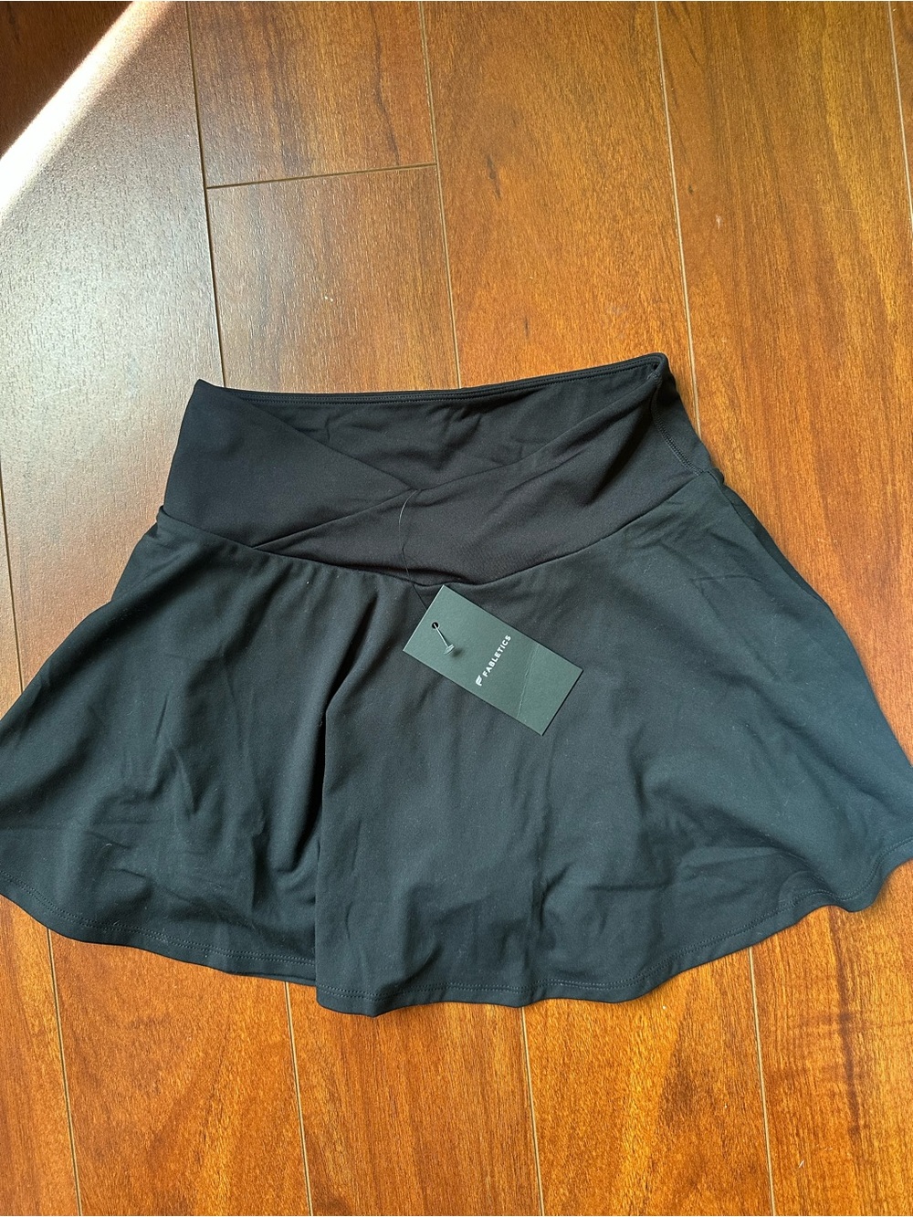 Fabletics Black tannins skirt Crossover Waistband with shirts